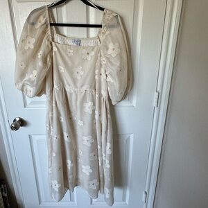 Light yellow/cream colored dress with embroidered daisies.